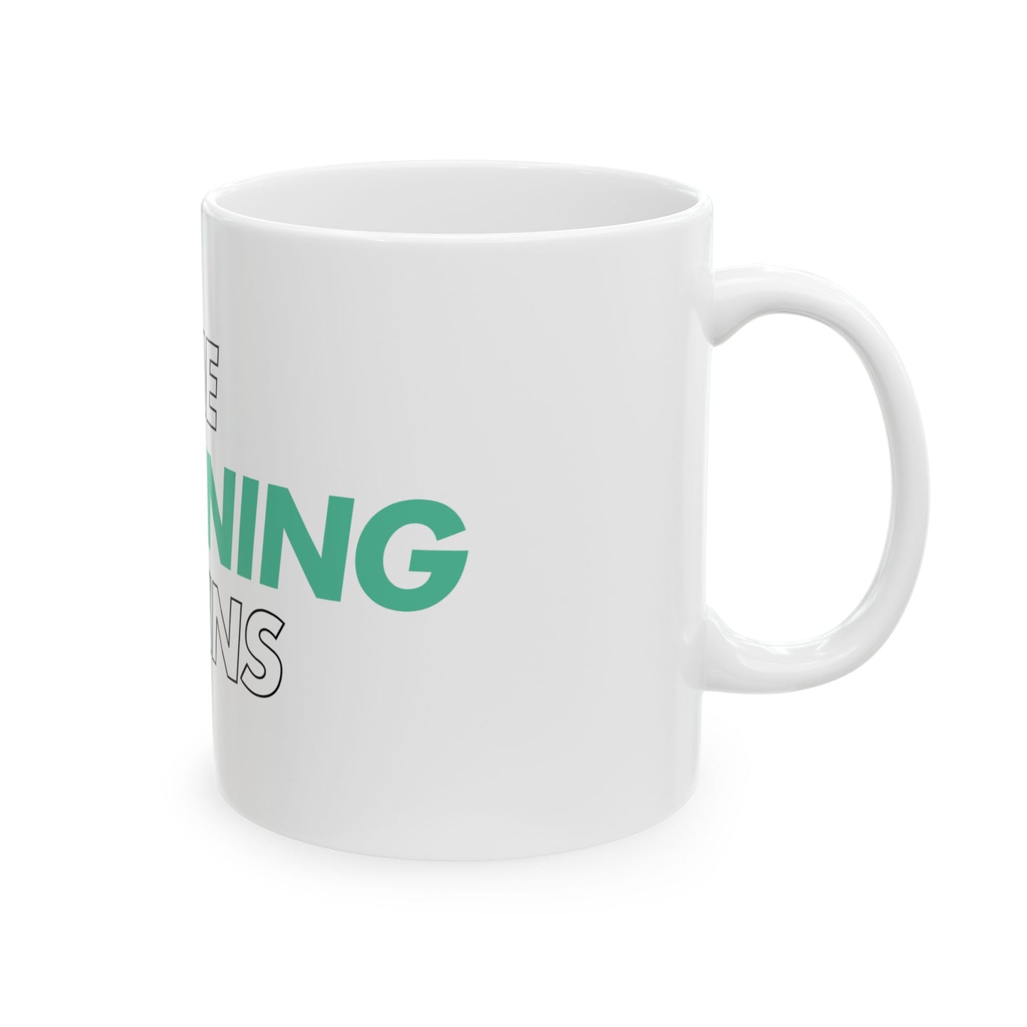White mug with green text on a white background
