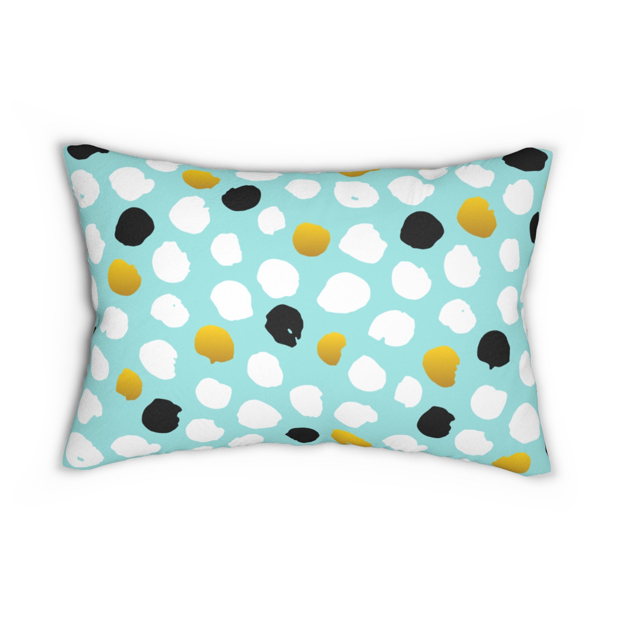 Decorative pillow with polka dot pattern on a light blue background