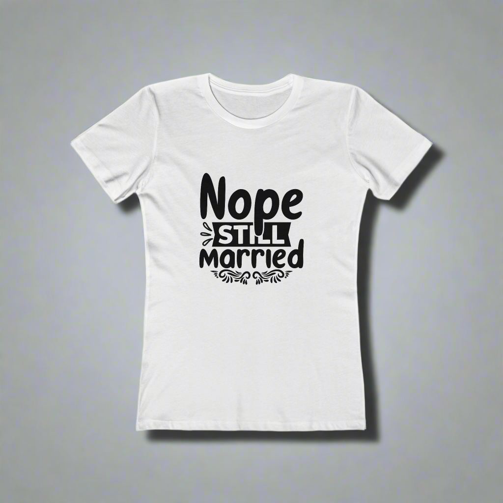 White t-shirt with black text 'Nope Still Married' on a gray background