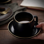 Mugs for coffee enthusiasts, Black Matte Ceramic Coffee Cup with gold trim and a saucer