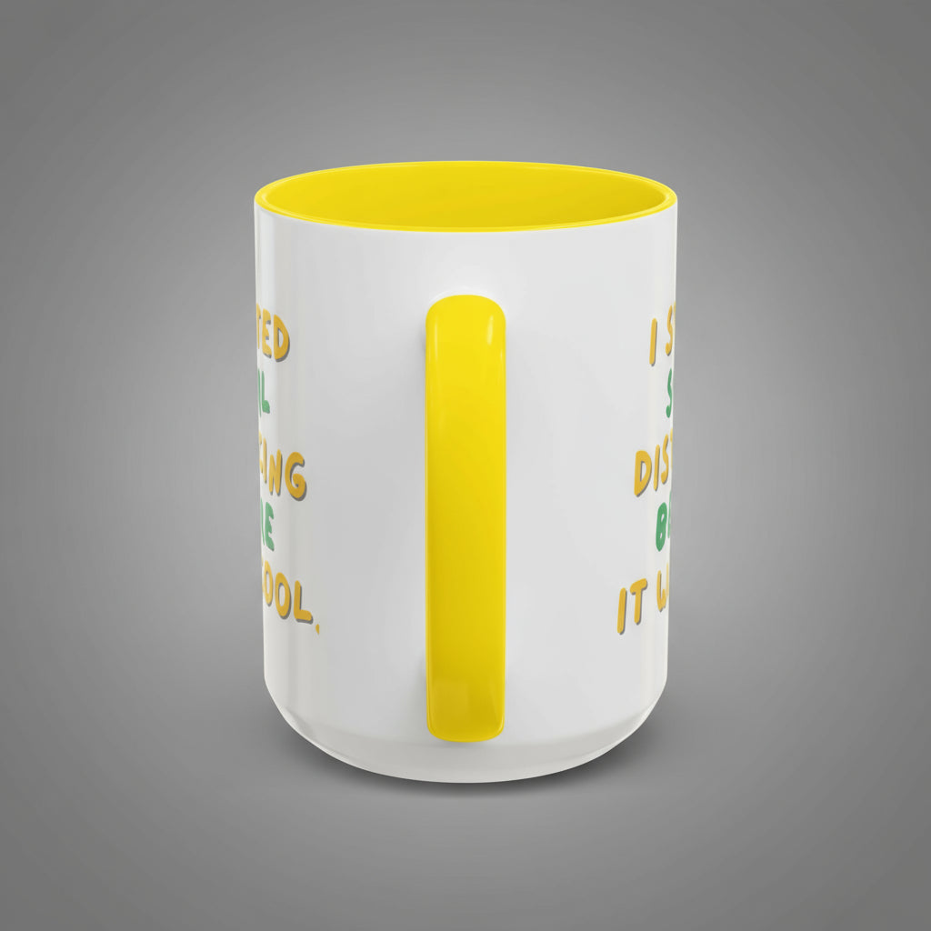 White mug with yellow interior and handle, featuring text on a white background