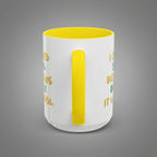 White mug with yellow interior and handle, featuring text on a white background