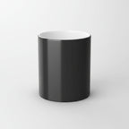 Black cylindrical object with white top on a white background