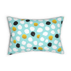 Decorative pillow with colorful polka dot pattern on a light blue background