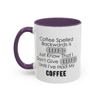 White mug with purple handle and interior, featuring humorous text about coffee spelling.