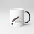 White mug with black handle featuring a design of a coffee cup and saucer on a white background