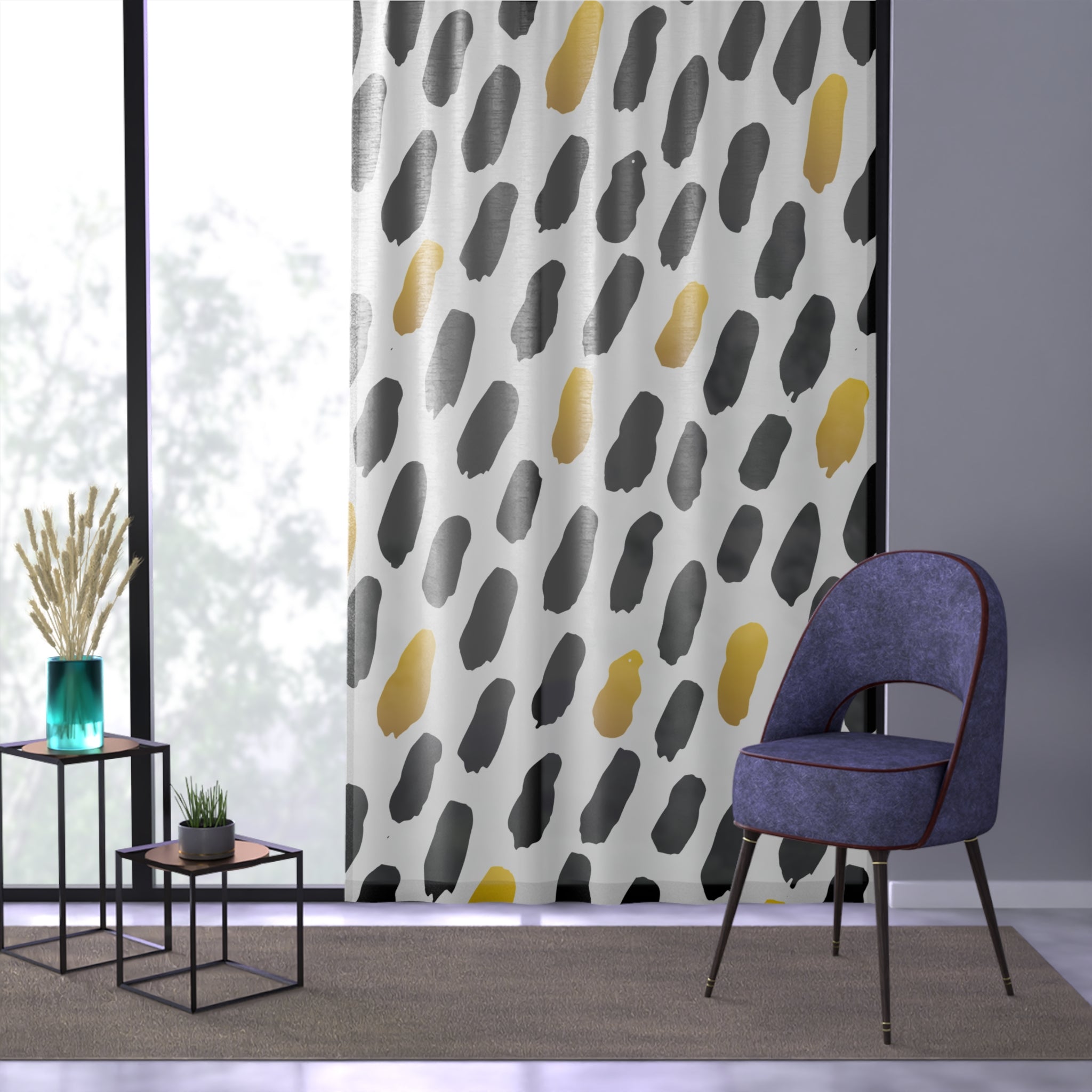 Patterned curtain with abstract design in a room with a chair and small tables.