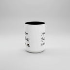 White mug with black interior and text on a white background