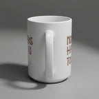 White mug with rose gold text on a white background
