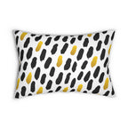 Decorative pillow with black and yellow abstract pattern on a white background