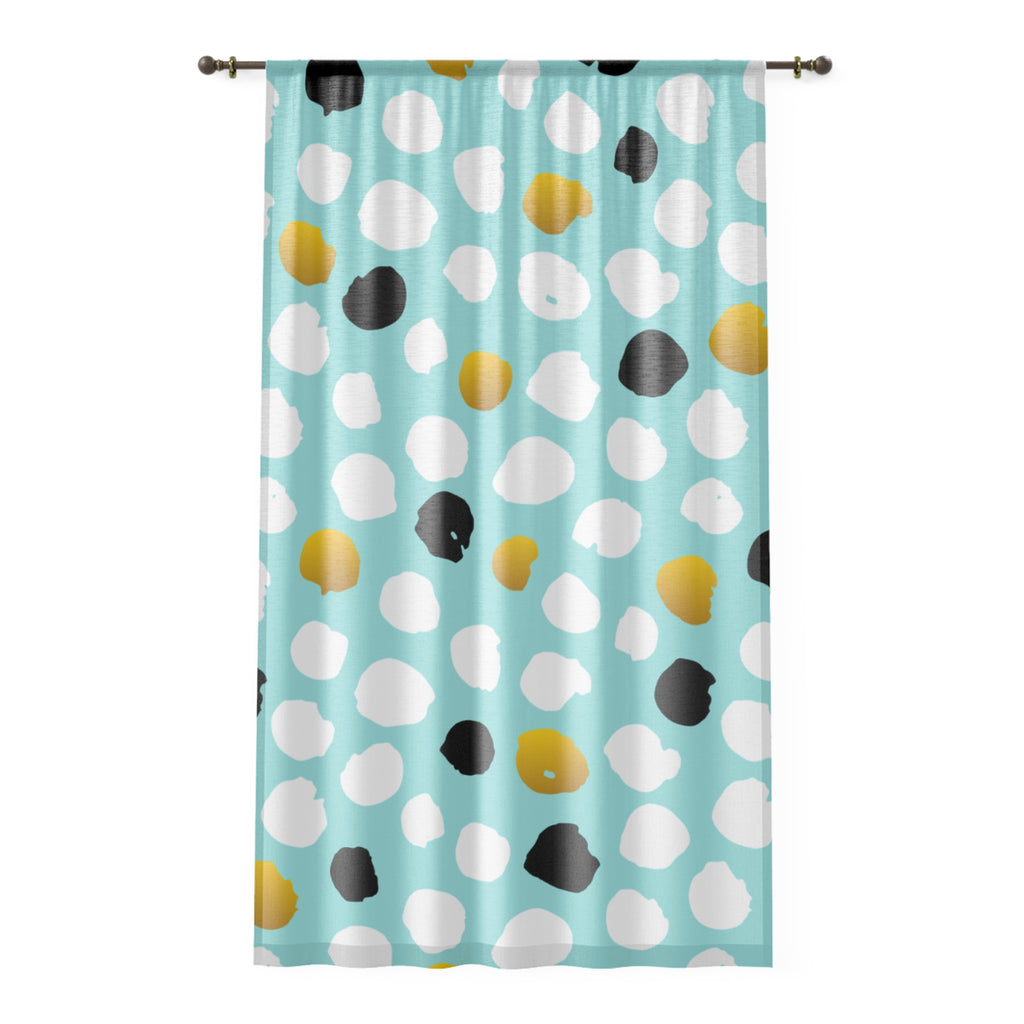 Curtain with colorful polka dot pattern on a light blue background