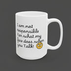 White mug with humorous text and emoji on a white background