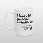 White mug with black text and a phone number on a white background