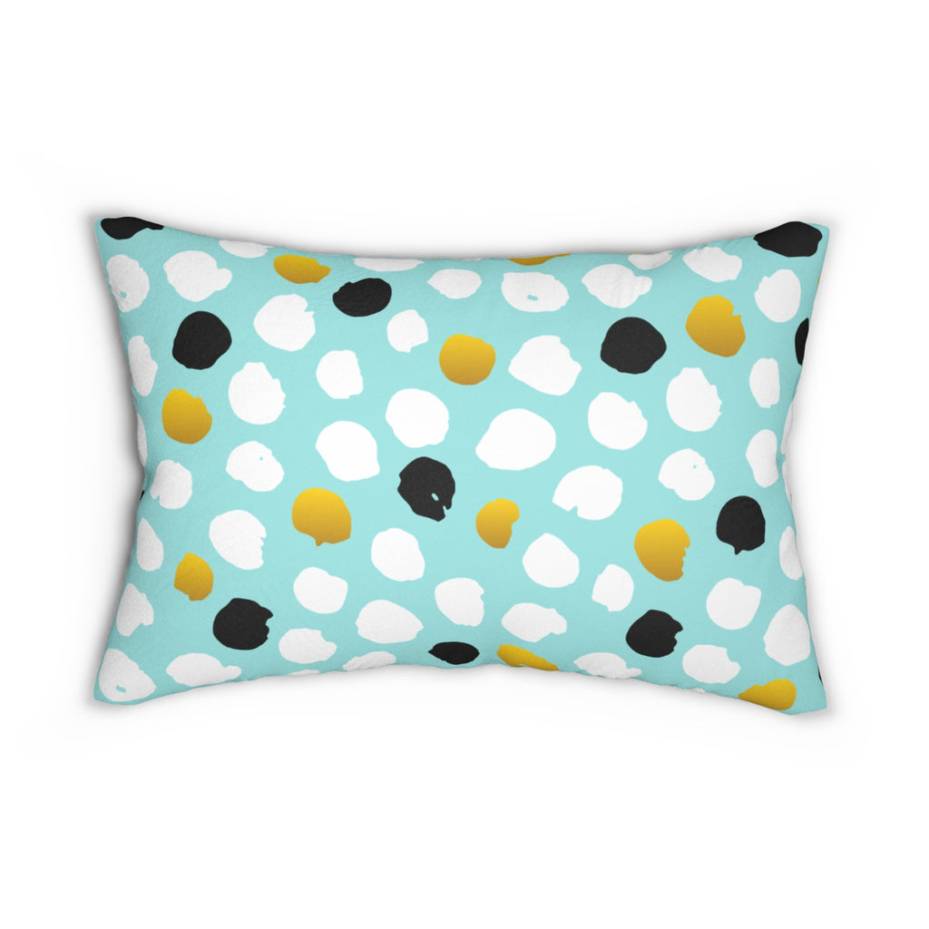 Decorative pillow with polka dot pattern on a light blue background