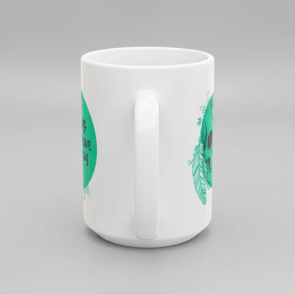 White mug with green and black designs on a white background
