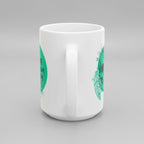 White mug with green and black designs on a white background