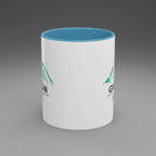 White mug with blue interior and green text on a white background