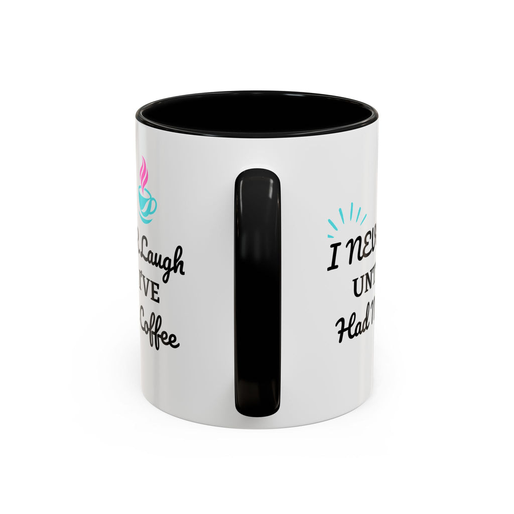 White mug with black interior and handle, featuring text and colorful designs on a white background