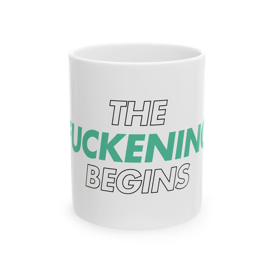 White mug with text 'THE FUCKENING BEGINS' on a white background