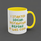 White mug with yellow interior and handle, featuring a humorous text design.
