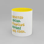 White mug with yellow interior and text on a white background