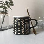 Coffee Mugs for any occasion, black ceramic mug with designs and spoon 