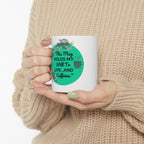Person holding a mug with a humorous quote about caffeine and living.