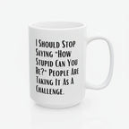 White mug with black text on a white background