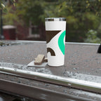 White tumbler with a logo on a wet surface outdoors