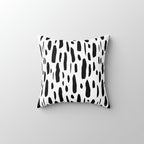 Decorative pillow with black abstract pattern on a white background
