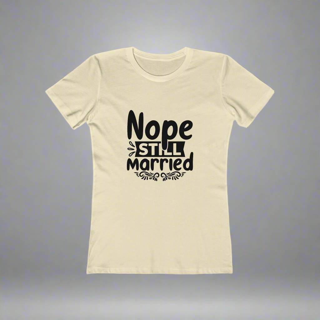 Beige t-shirt with black text 'Nope Still Married' on a gray background