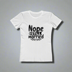 White t-shirt with black text 'Nope Still Married' on a gray background